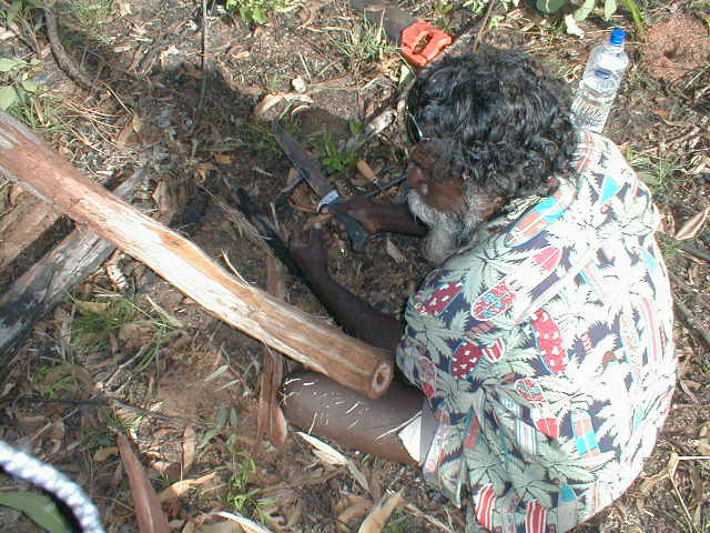 Djalu carving a didgeridoo